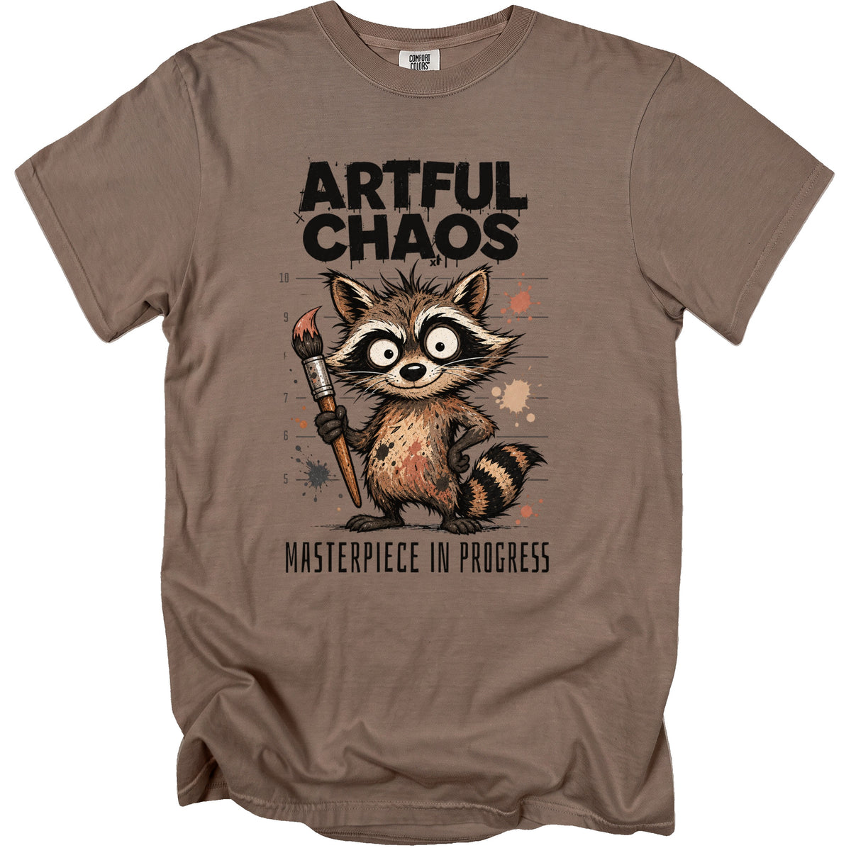 T-shirt with "Artful Chaos" text and a raccoon holding a paintbrush.