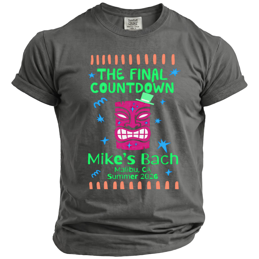 T-shirt with pink tiki mask, green hat, and text "The Final Countdown Mike's Bach Malibu, CA Summer 2026".