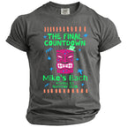 T-shirt with pink tiki mask, green hat, and text "The Final Countdown Mike's Bach Malibu, CA Summer 2026".