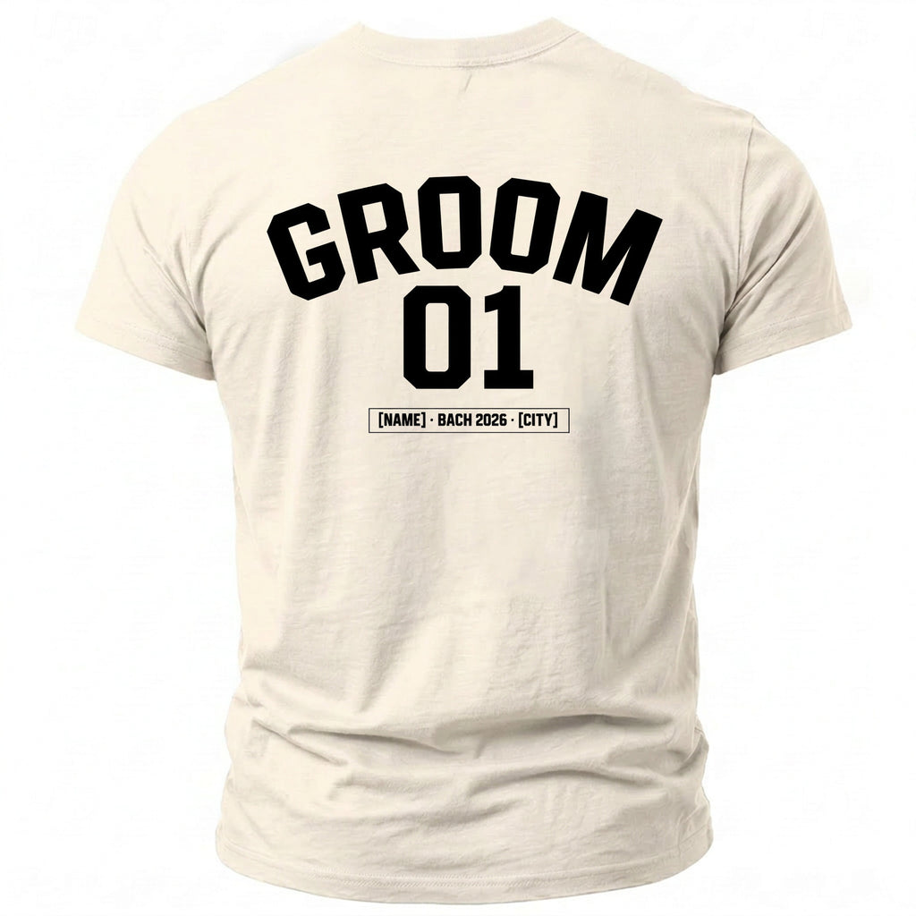 Cream t-shirt with black text "GROOM 01 [NAME] - BACH 2026 - [CITY]".