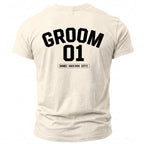 Cream t-shirt with black text "GROOM 01 [NAME] - BACH 2026 - [CITY]".