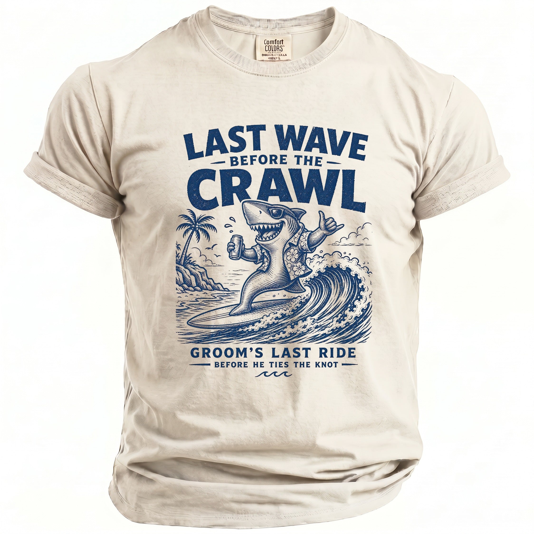 Cream t-shirt with shark surfing and text "Last Wave Before The Crawl".
