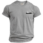 Gray t-shirt with a black golf ball and grass graphic on the chest.