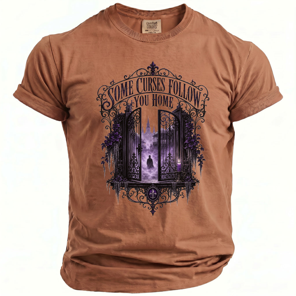 Brown t-shirt with "Some Curses Follow You Home" text and ornate gate graphic.