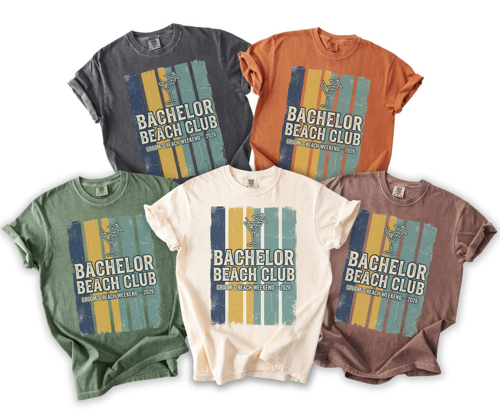 Five t-shirts in various colors with "Bachelor Beach Club Groom's Beach Weekend 2026" graphic.