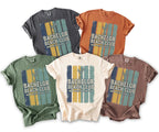 Five t-shirts in various colors with "Bachelor Beach Club Groom's Beach Weekend 2026" graphic.