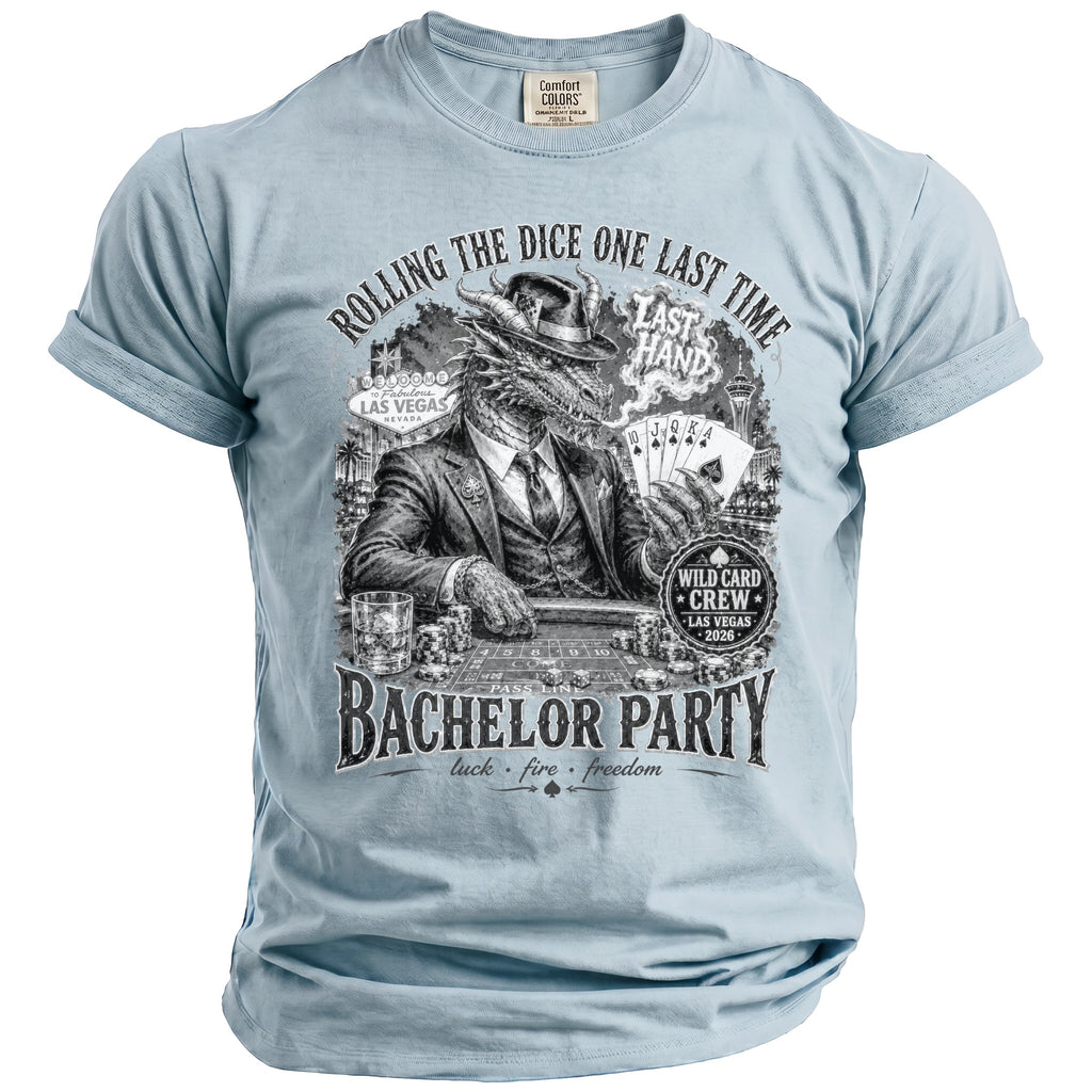 Light blue t-shirt with black graphic of a dragon in a suit playing cards in Las Vegas.