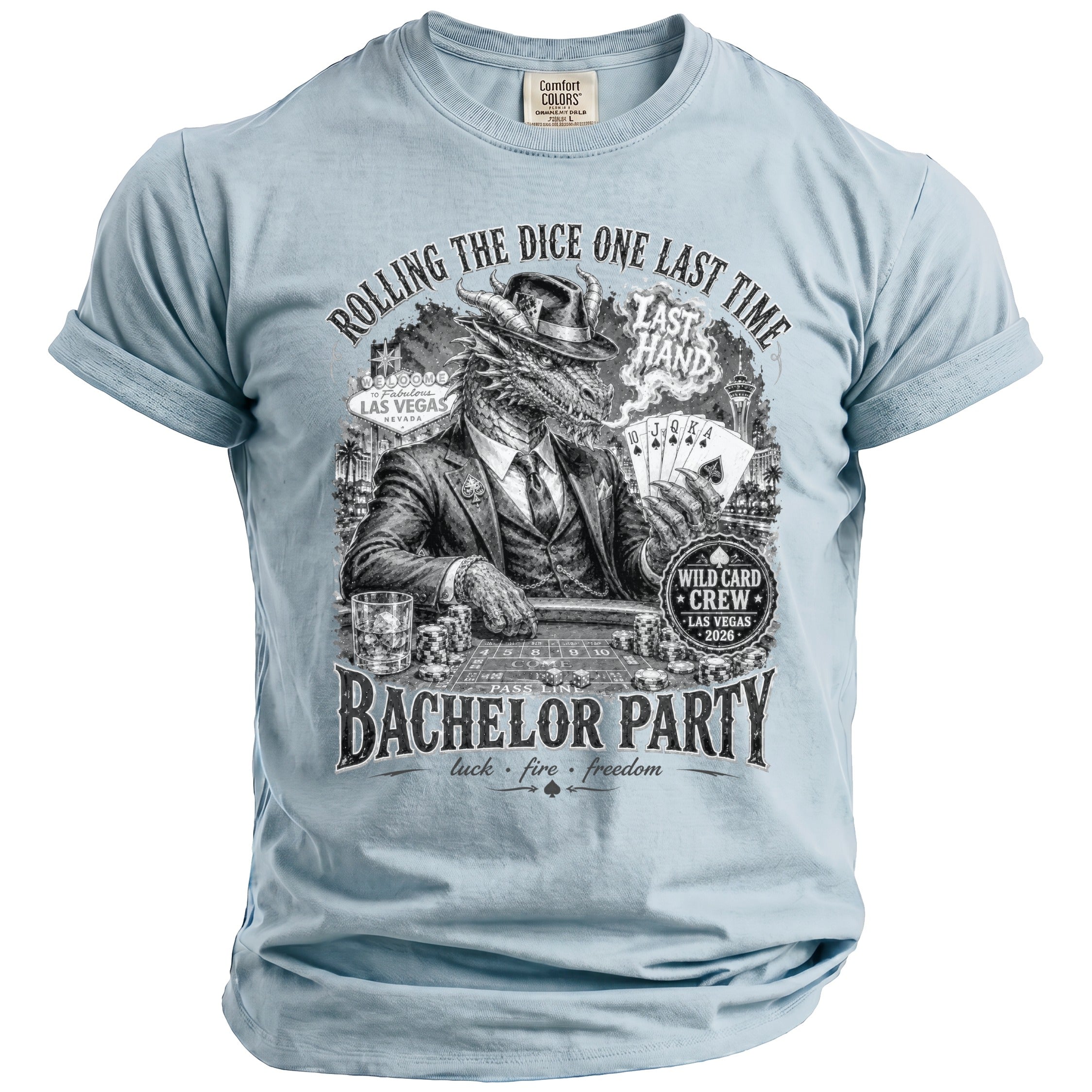 Light blue t-shirt with black graphic of a dragon in a suit playing cards in Las Vegas.