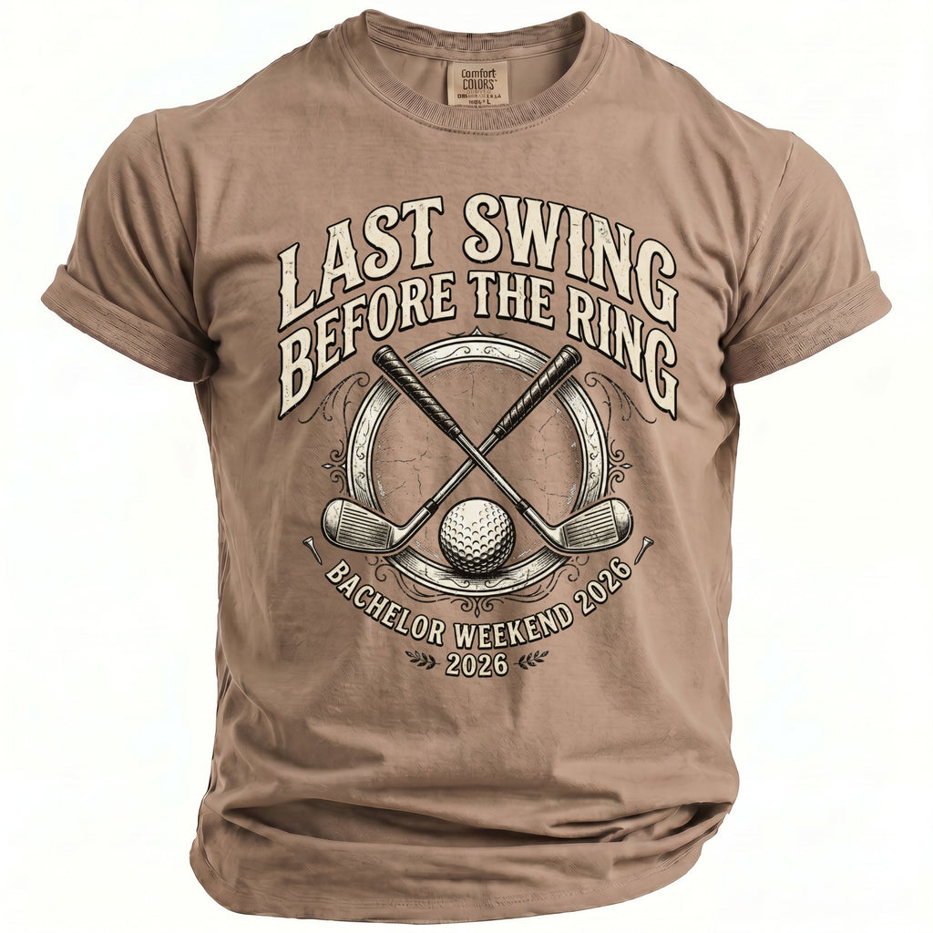 Taupe t-shirt with "Last Swing Before the Ring Bachelor Weekend 2026" text and golf graphics.