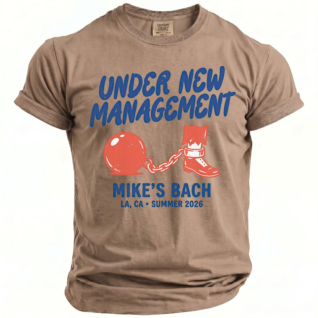 Taupe shirt with "Under New Management Mike's Bach" text and graphics.