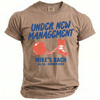 Taupe shirt with "Under New Management Mike's Bach" text and graphics.