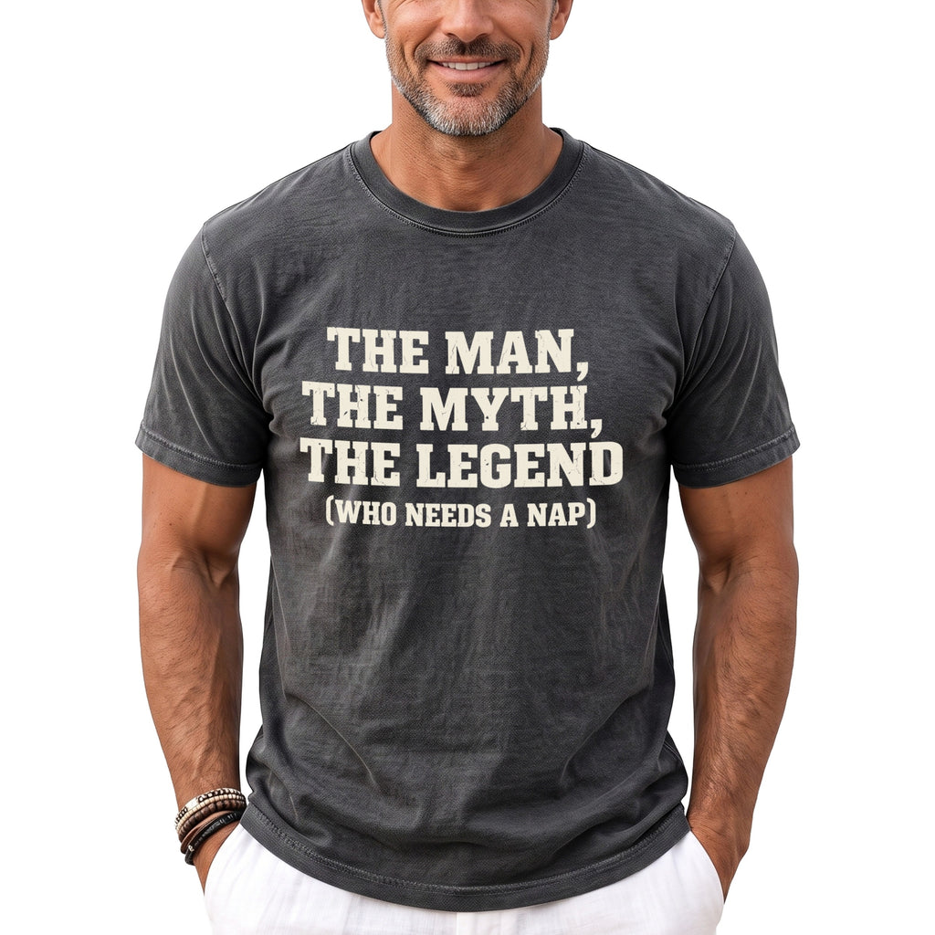 Man wearing dark grey t-shirt with white text: The Man, The Myth, The Legend (Who Needs a Nap).