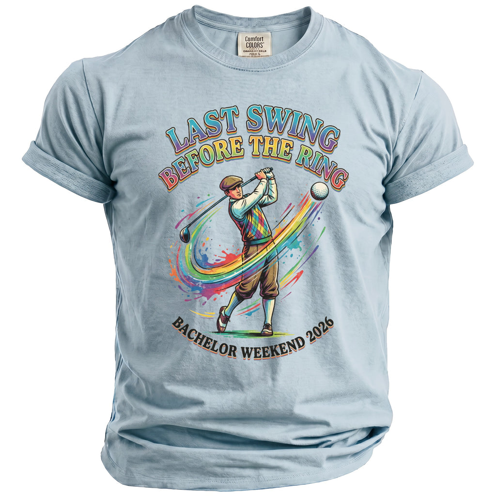 Light blue t-shirt with "Last Swing Before the Ring" and "Bachelor Weekend 2026" text and golf graphic.