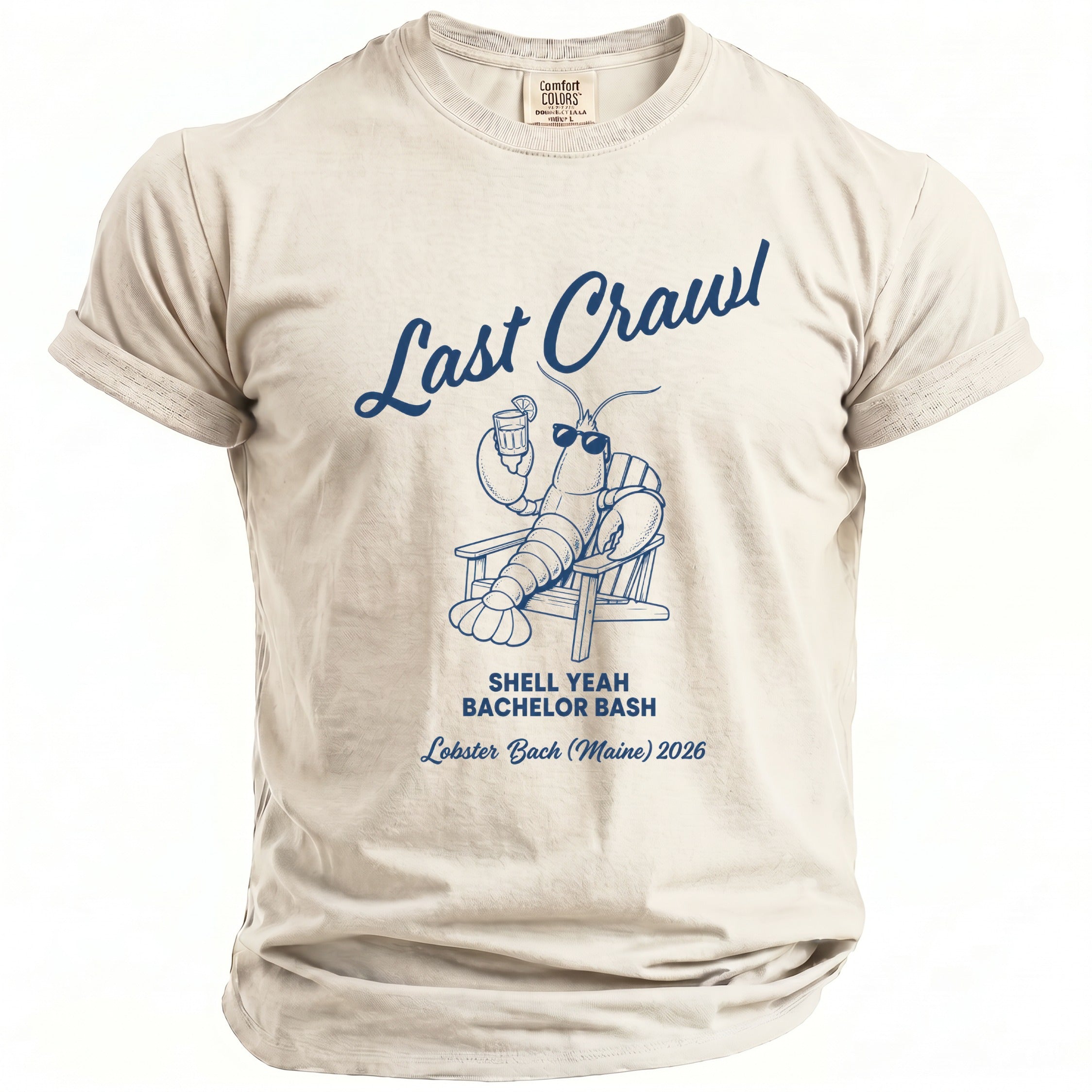 Light tan t-shirt with lobster graphic and "Last Crawl Shell Yeah Bachelor Bash Lobster Bach (Maine) 2026" text.