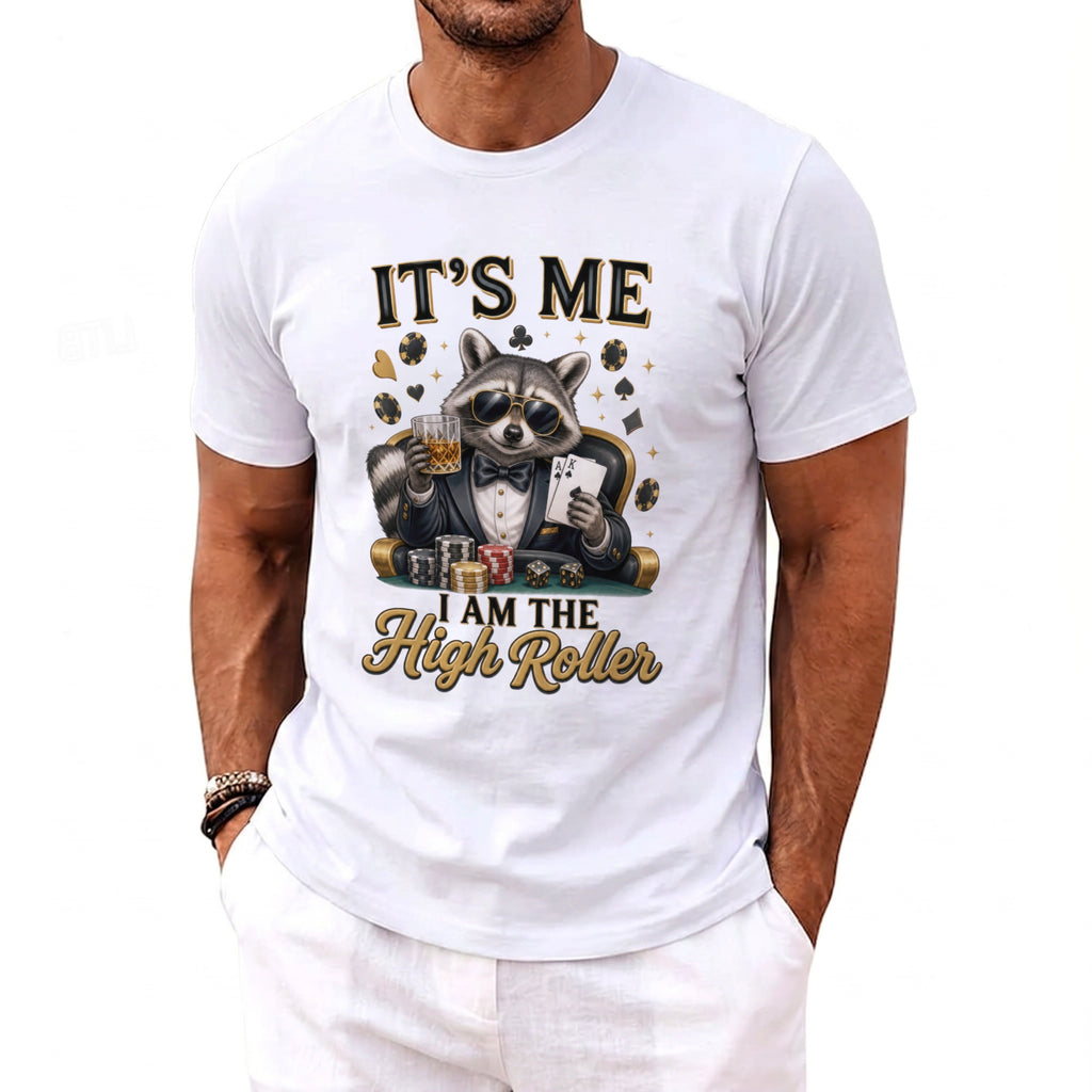 White t-shirt with raccoon playing poker, holding cards and drink, text "IT'S ME I AM THE High Roller".