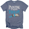 T-shirt with "Painting is cheaper than therapy" text and paint tube graphic.
