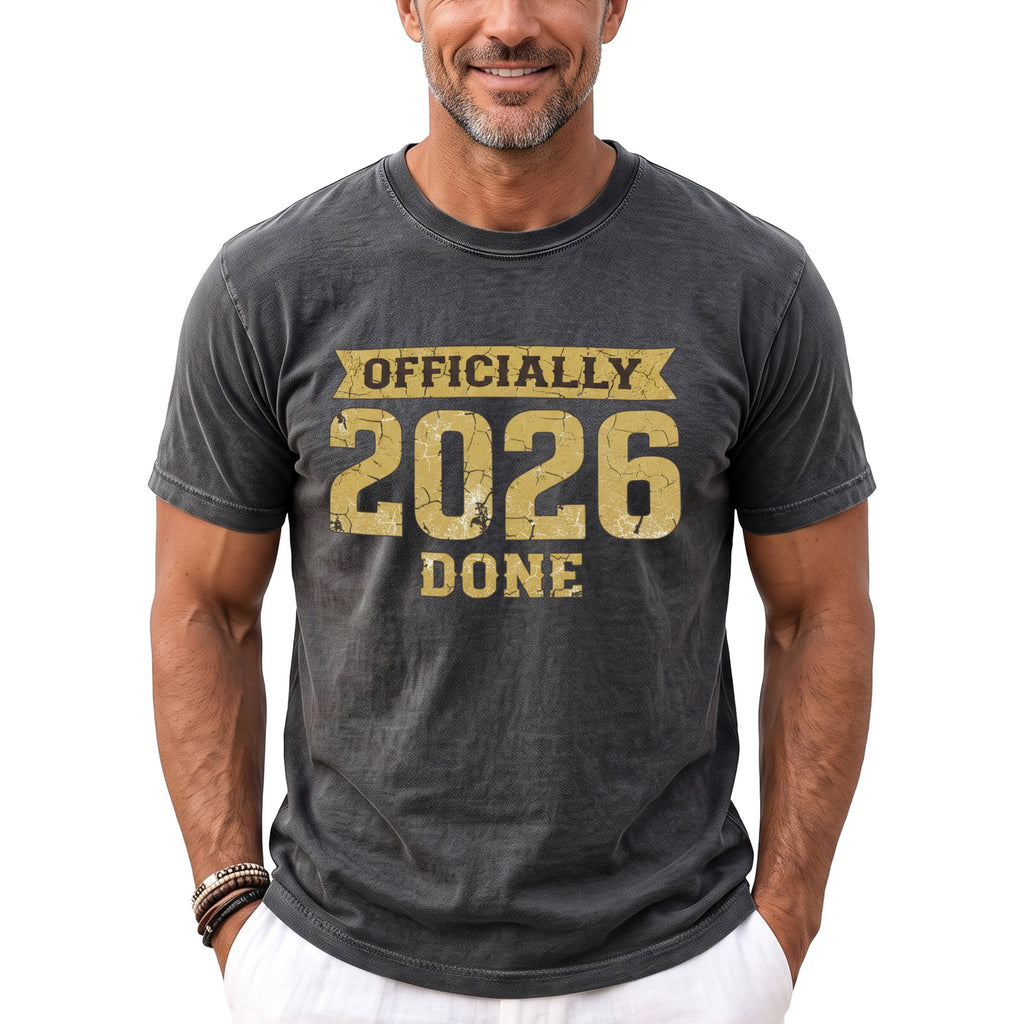 Dark grey t-shirt with gold text "OFFICIALLY 2026 DONE"