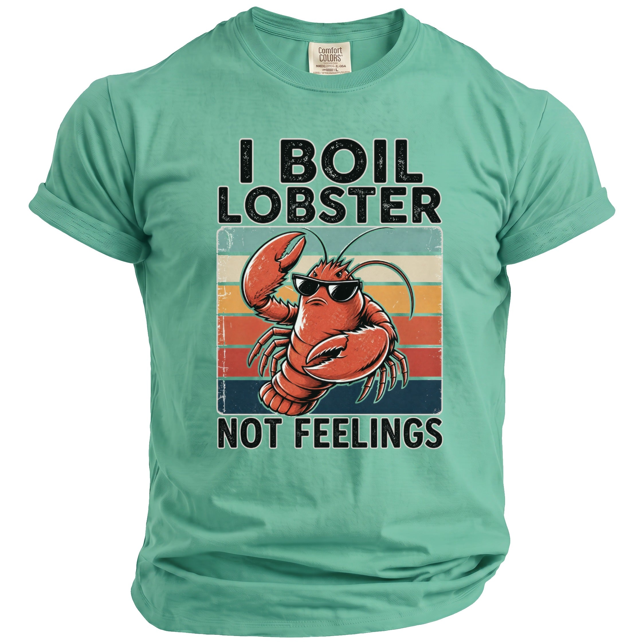 Green t-shirt with graphic of a lobster wearing sunglasses and text I BOIL LOBSTER NOT FEELINGS.
