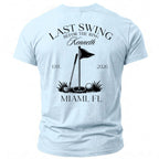 Light blue t-shirt with "Last Swing B4 the Ring Kenneth" and golf graphics.