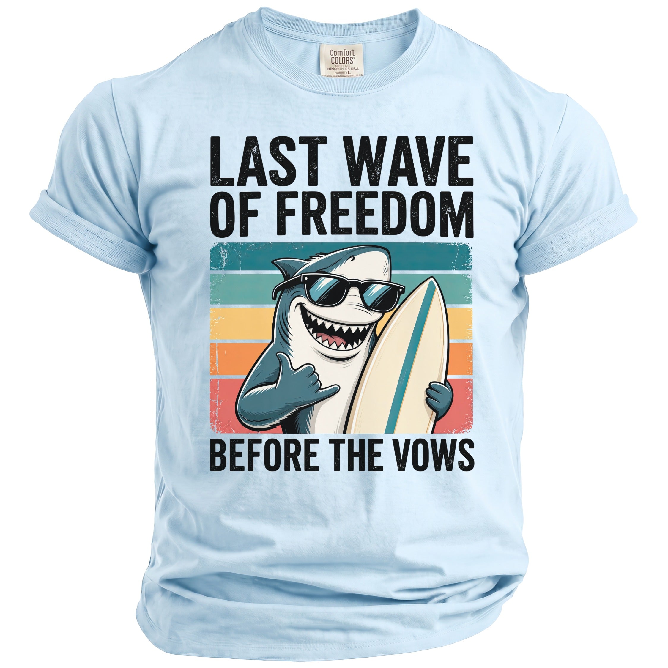 Light blue t-shirt with shark surfing graphic and text "Last Wave of Freedom Before the Vows".