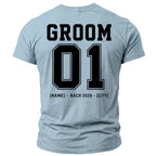 Pale blue t-shirt with black text: GROOM, 01, [NAME] • BACH 2026 • [CITY].