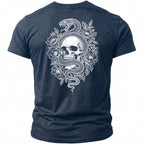 Dark blue t-shirt with white snake and skull design surrounded by flowers.