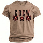 Tan t-shirt with "CREW" text and three red devil masks.