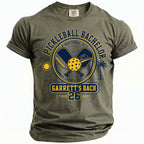 Olive green t-shirt with "Pickleball Bachelor Scottsdale, AZ Summer 2026 Garrett's Bach 26" graphic.