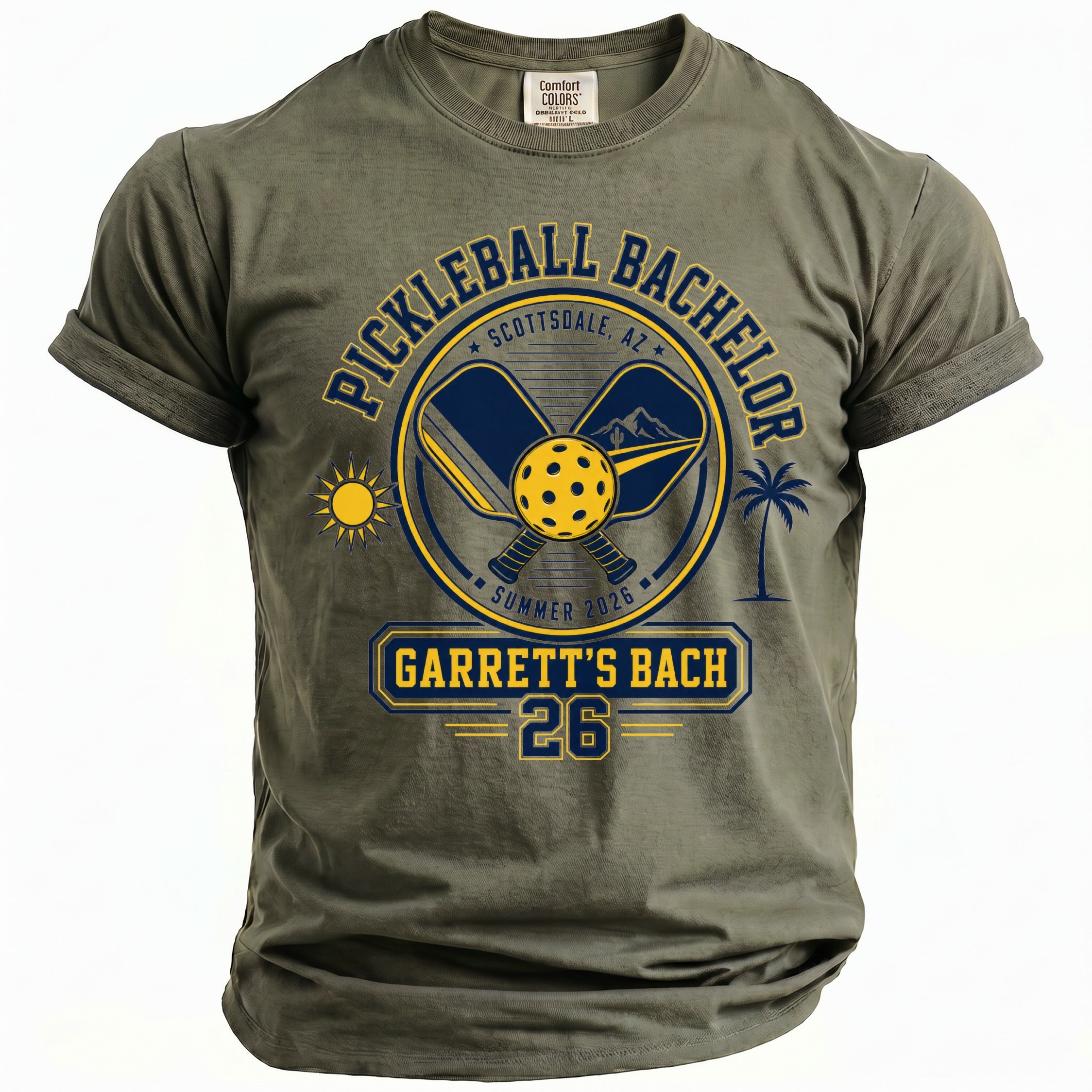 Olive green t-shirt with "Pickleball Bachelor Scottsdale, AZ Summer 2026 Garrett's Bach 26" graphic.