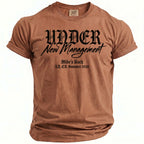 Brown t-shirt with "UNDER New Management" and "Mike's Bach LA, CA. Summer 2026".
