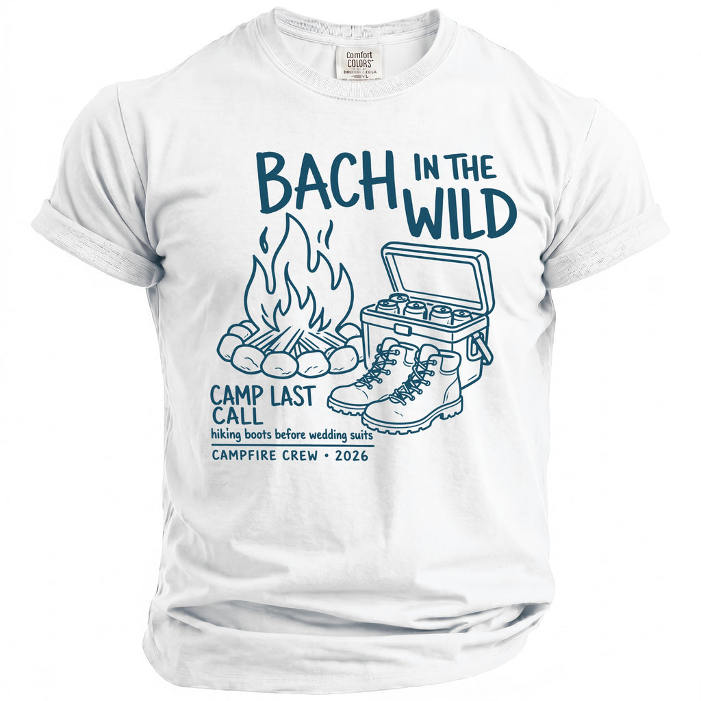 White t-shirt with navy graphic "Bach in the Wild," campfire, cooler, boots, and text.