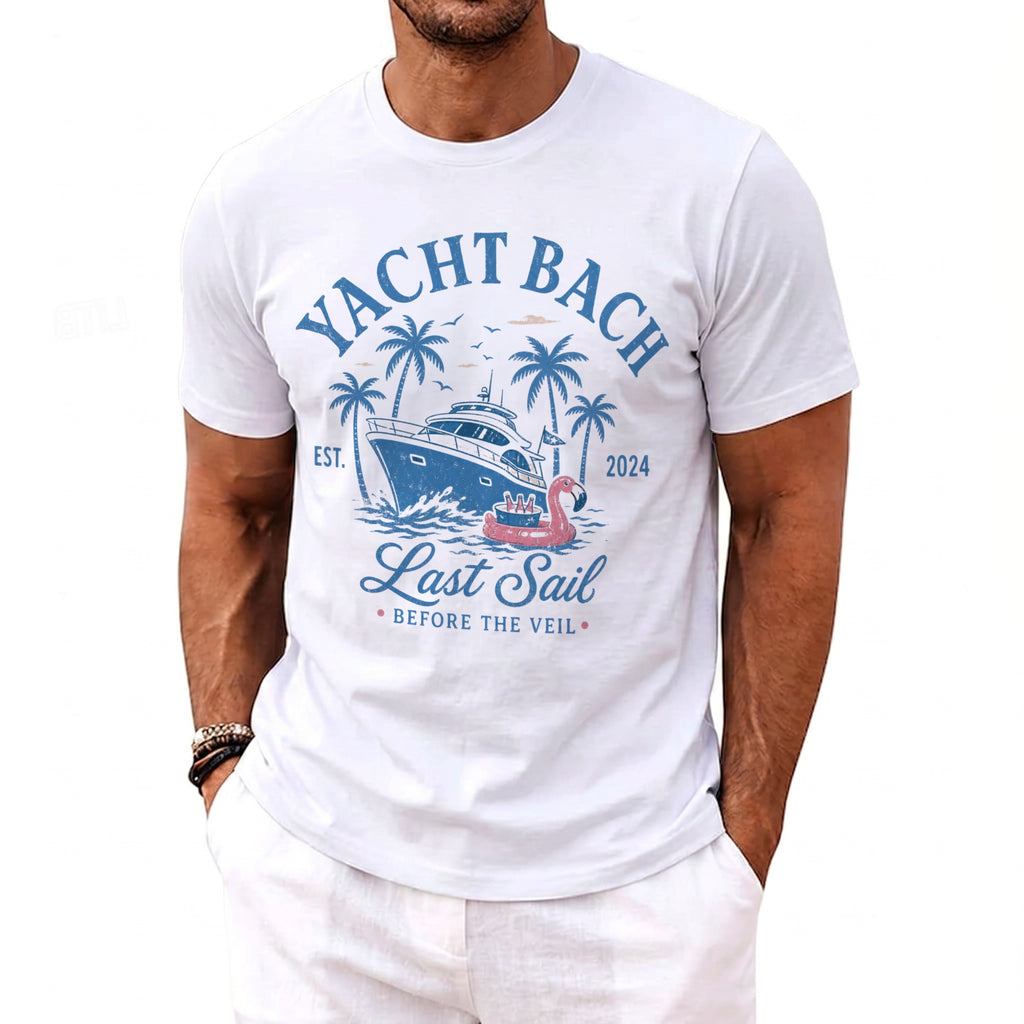 White t-shirt with "Yacht Bach Last Sail Before The Veil" text, yacht, palm trees, and flamingo float.