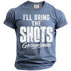 Blue t-shirt with "I'LL BRING THE SHOTS GROOMSMAN" in white distressed print.