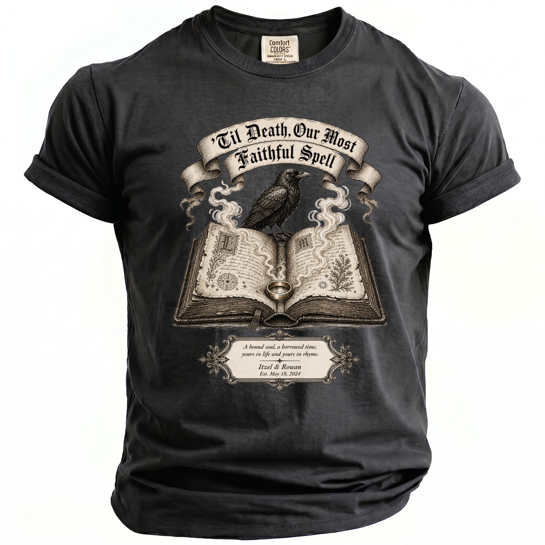Dark grey t-shirt with a raven on an open book, titled "Til Death, Our Most Faithful Spell."