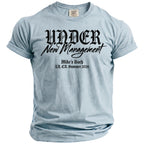 Light blue t-shirt with black text: "UNDER New Management, Mike's Bach, L.A., CA. Summer 2026".