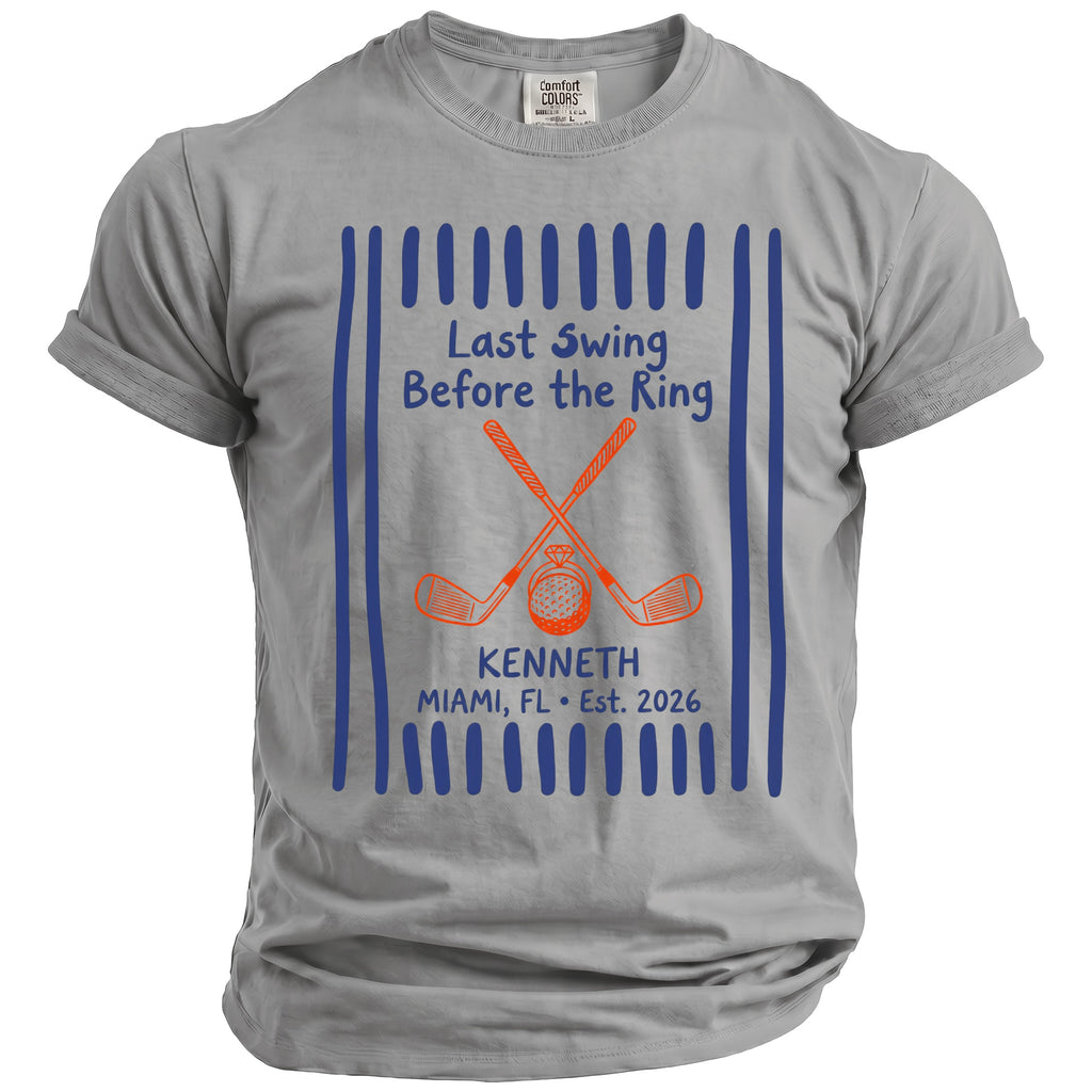 Grey t-shirt with "Last Swing Before the Ring" text, golf clubs, and ring illustration.