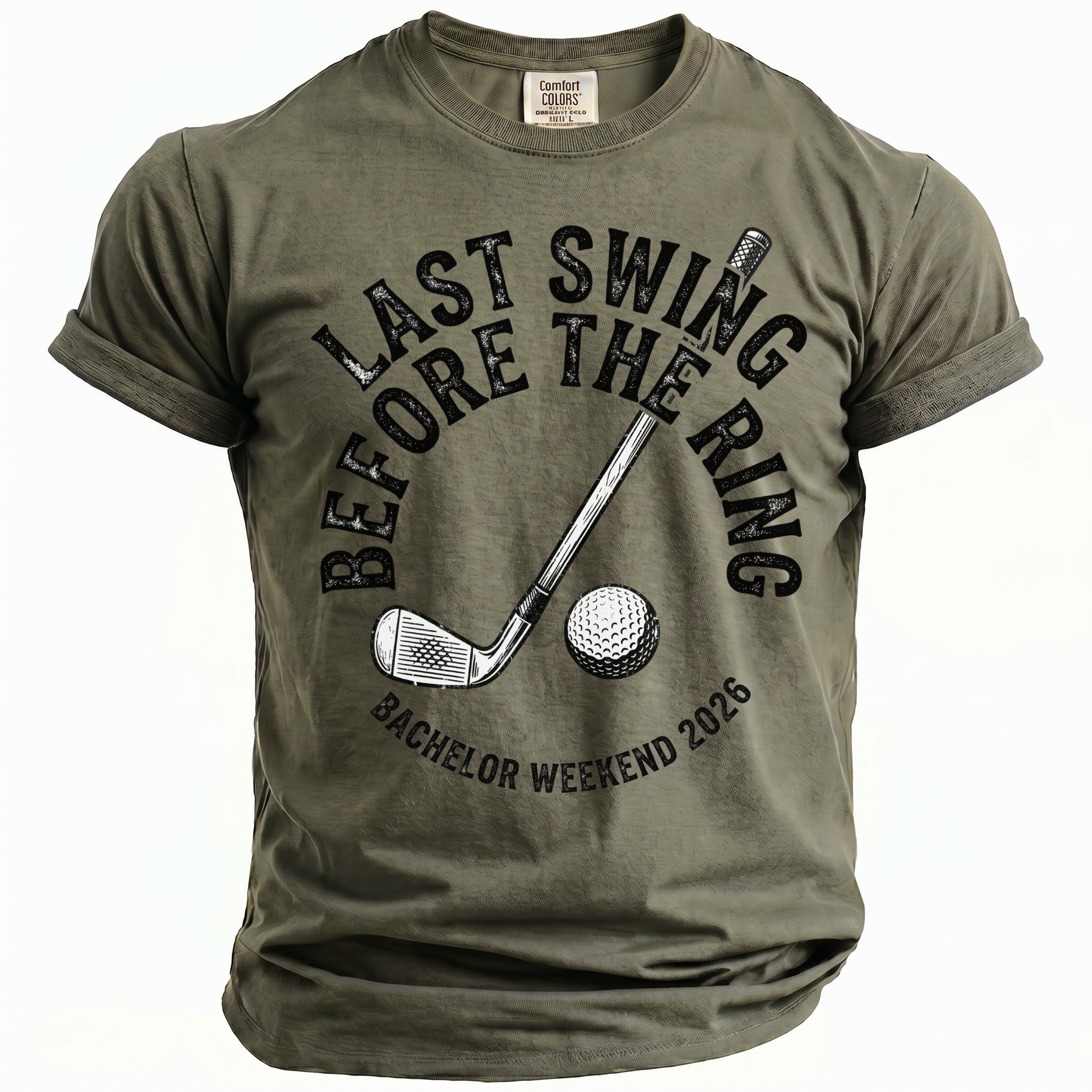 Olive green t-shirt with golf club, ball, and text "Last Swing Before The Ring Bachelor Weekend 2026".
