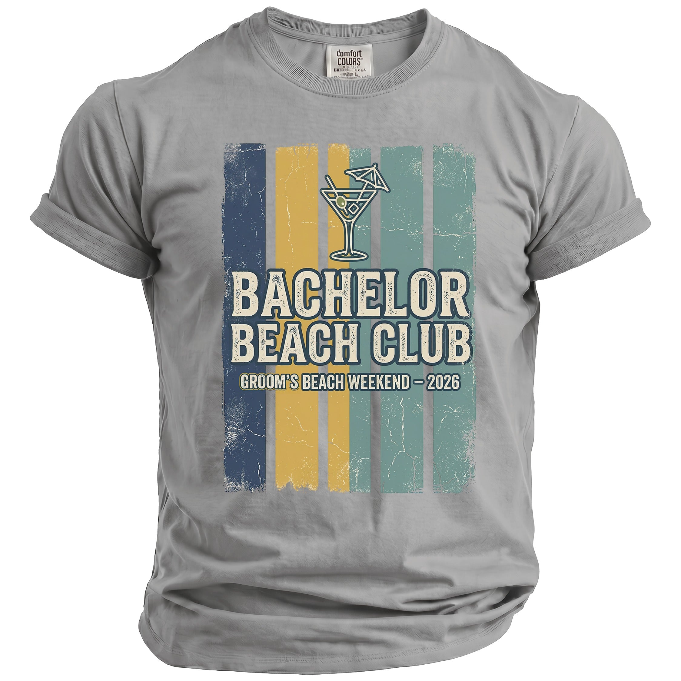 Grey t-shirt with "Bachelor Beach Club" and "Groom's Beach Weekend - 2026" text.