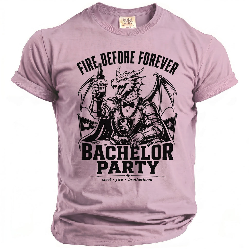 Pink shirt with a dragon graphic wearing armor and holding a beer, text reads "Fire Before Forever Bachelor Party".