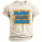 Light tan t-shirt with "BLUES BACH SCENE" in blue and gray bubble letters.