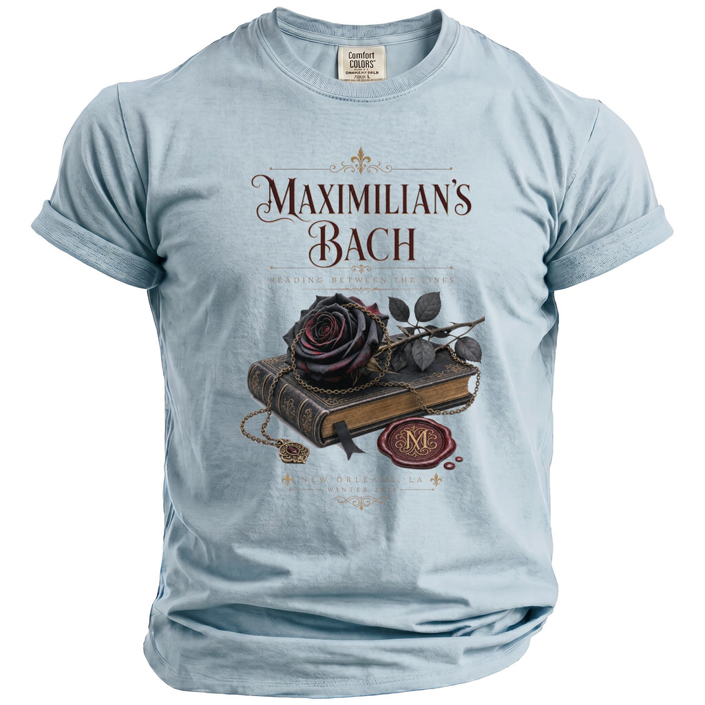 Light blue t-shirt with "Maximilian's Bach" and a dark rose on a book.