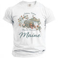 White t-shirt with a graphic of a lobster in a trap, lighthouse, and flowers with text.