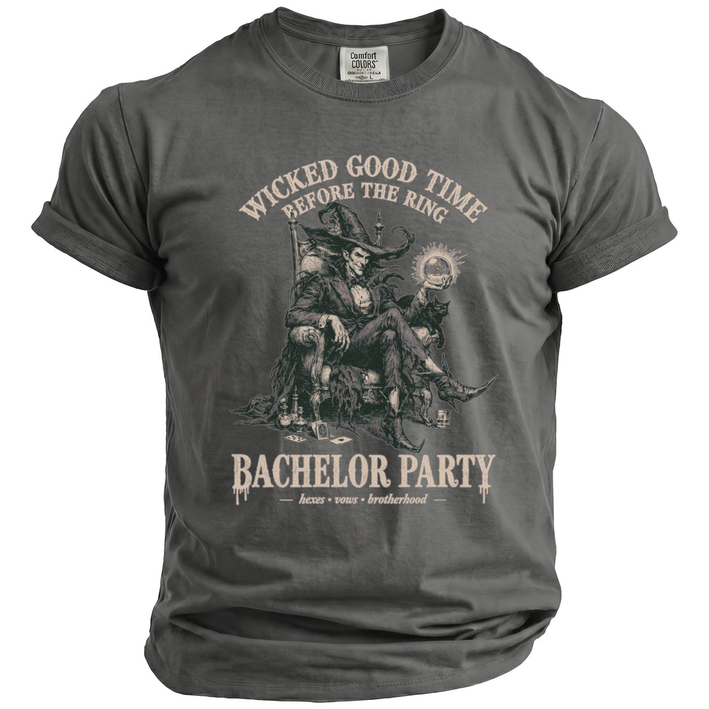 T-shirt with graphic of a witch-like figure holding a ring and text "Wicked Good Time Before the Ring" and "Bachelor Party".