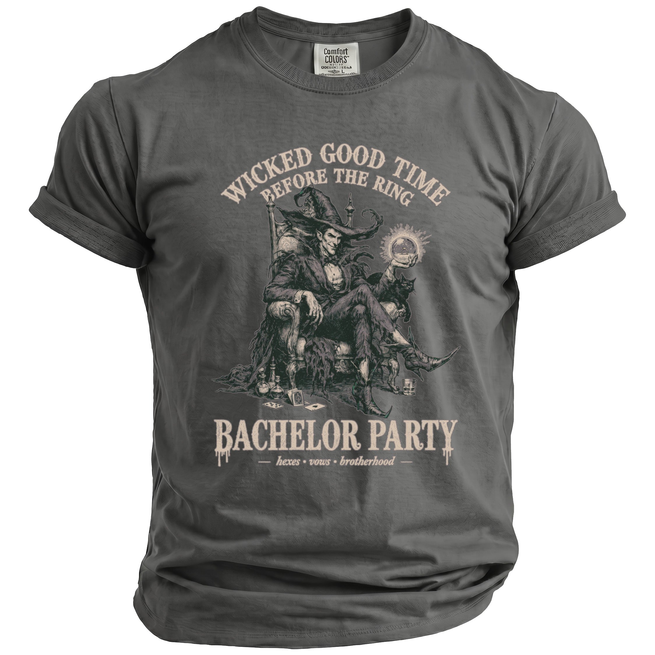 T-shirt with graphic of a witch-like figure holding a ring and text "Wicked Good Time Before the Ring" and "Bachelor Party".