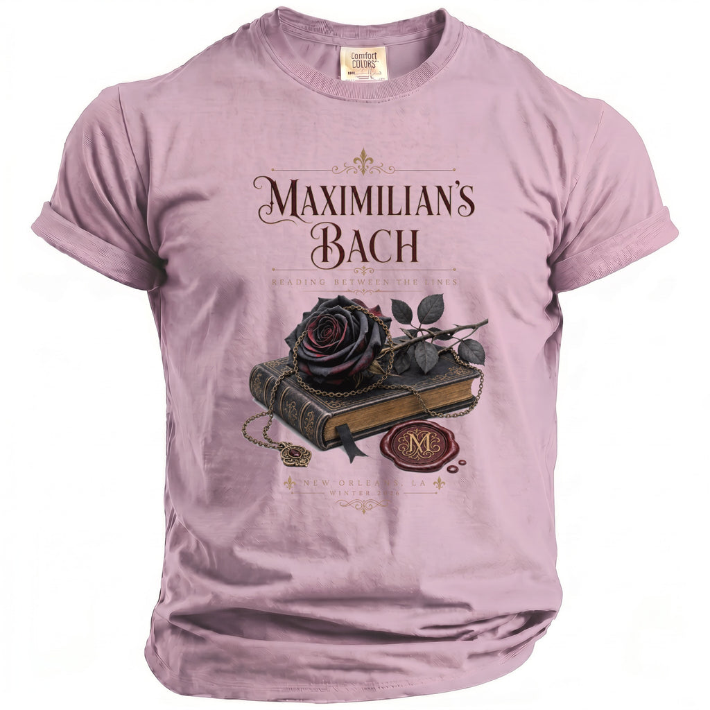 Pink t-shirt with "Maximilian's Bach Reading Between the Lines" and book graphic.