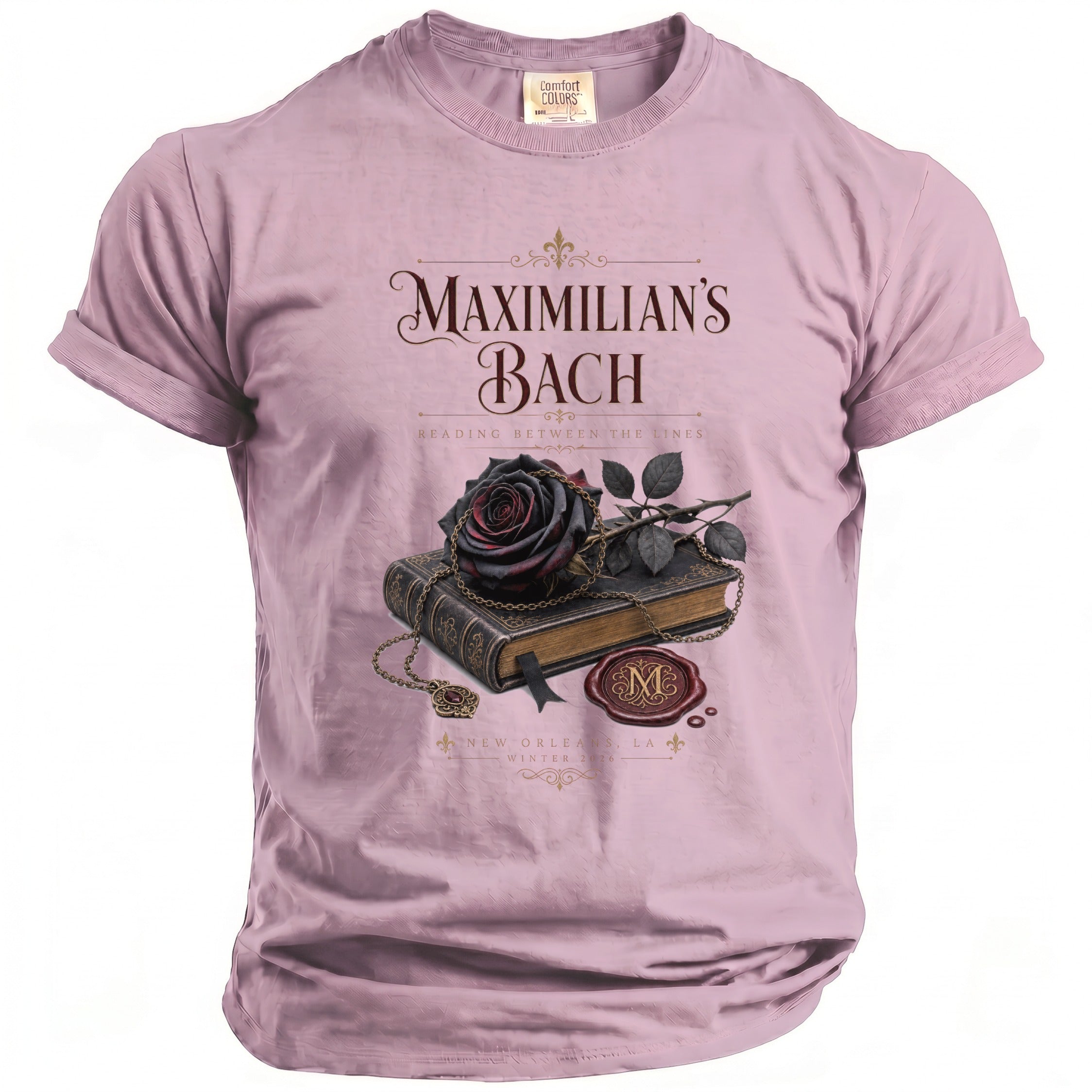 Pink t-shirt with "Maximilian's Bach Reading Between the Lines" and book graphic.