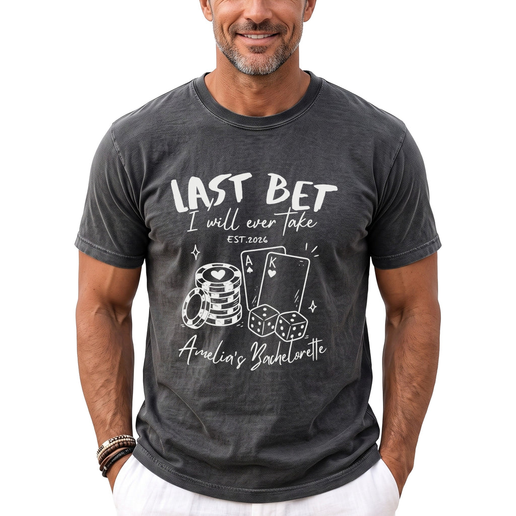 Dark grey t-shirt with white text and graphics for "Last Bet Amelia's Bachelorette."