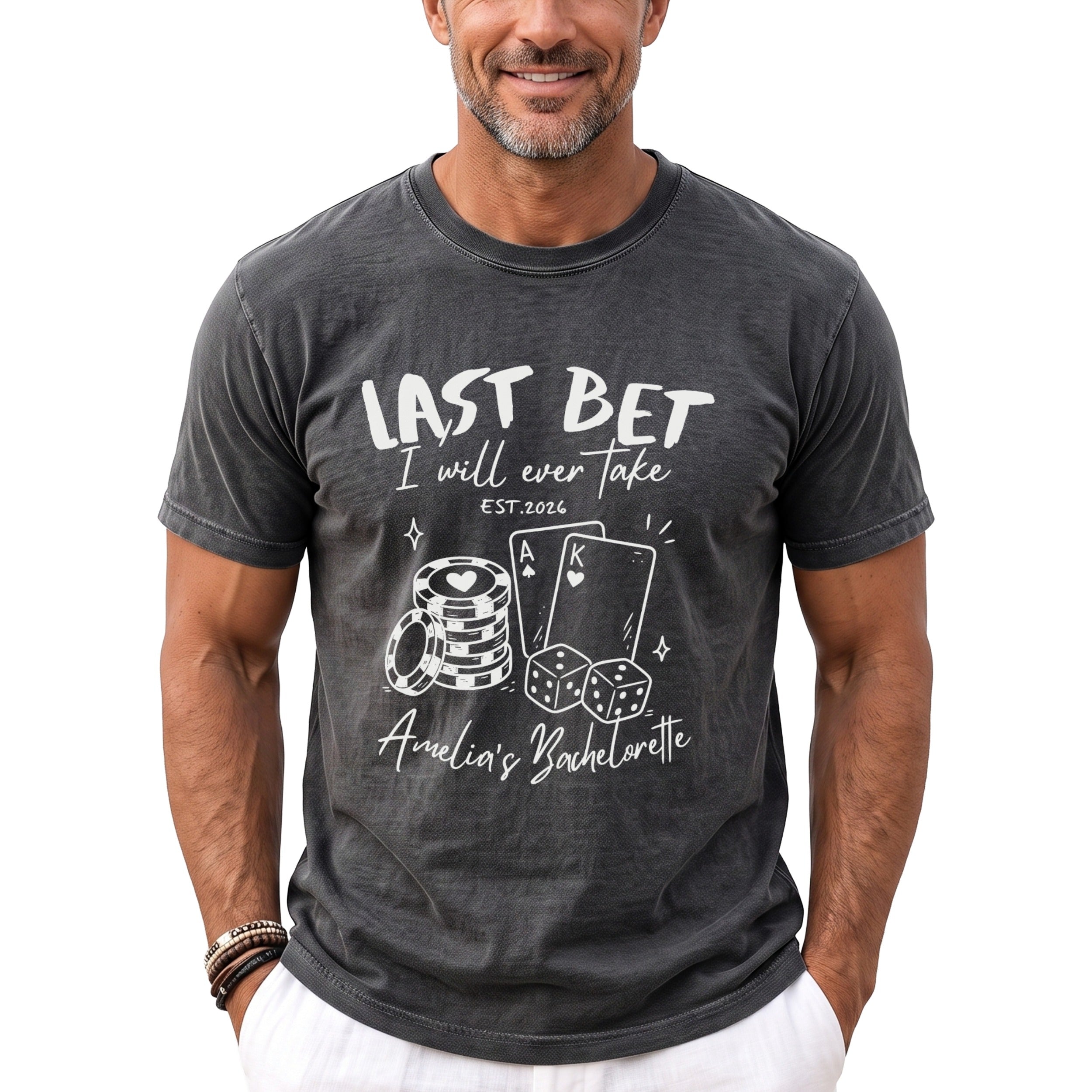 Dark grey t-shirt with white text and graphics for "Last Bet Amelia's Bachelorette."