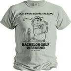 T-shirt graphic with text "Last Swing Before the Ring" and a cartoon dragon golfing.