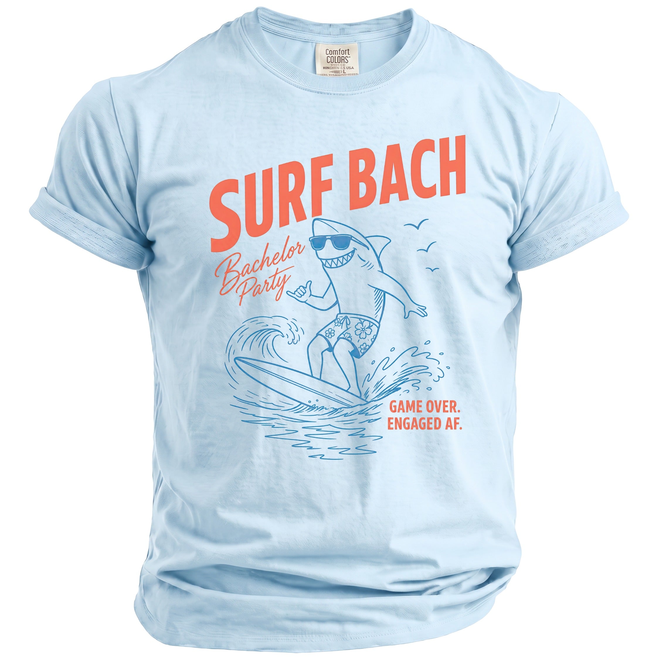 Light blue t-shirt with "Surf Bach Bachelor Party" graphic of a surfing shark.